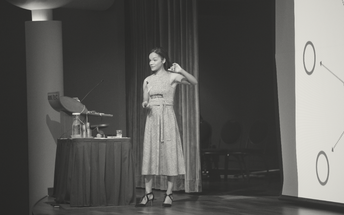 Adaira Landry speaking on stage