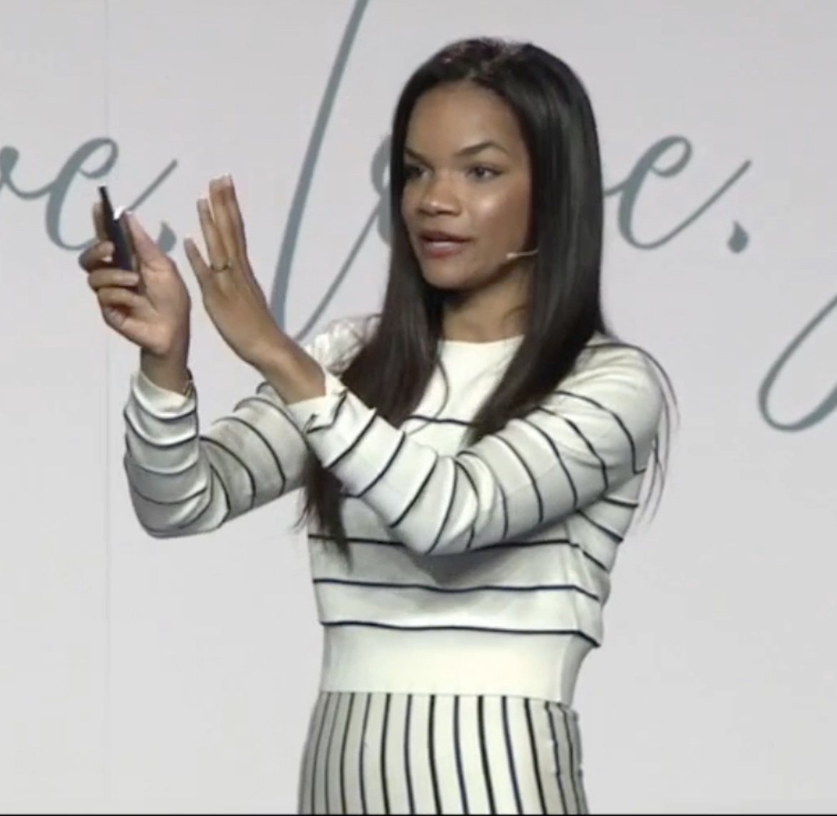 Dr. Adaira Landry speaking on stage